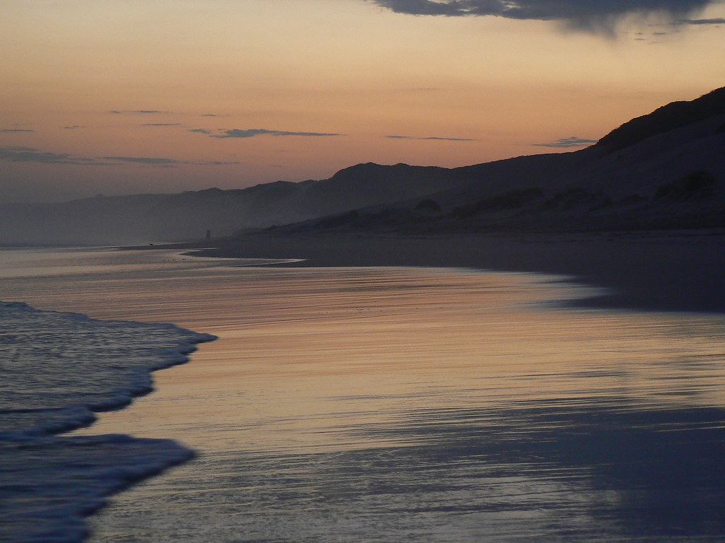 Dana Bay sunset with golden reflections on the shore